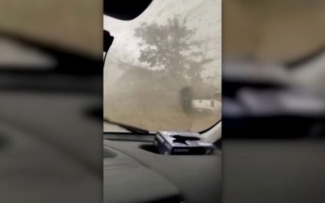Man rides out tornado inside van. See the footage