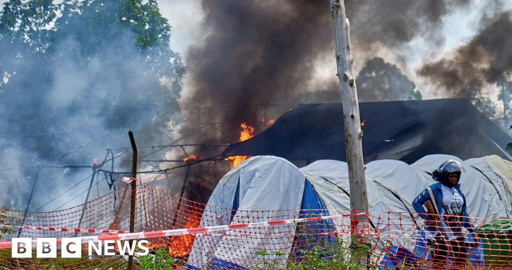 Angry crowd sets Ebola hospital tents on fire in DR Congo