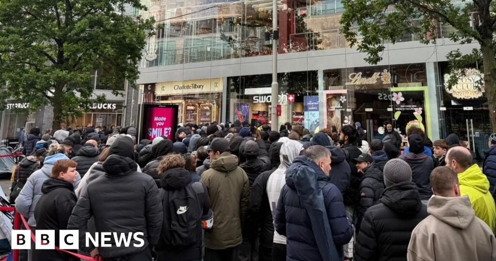Massive queues shut Swatch stores as hundreds clamour for £335 limited edition watch