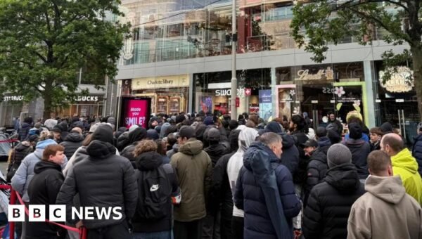 Massive queues shut Swatch stores as hundreds clamour for £335 limited edition watch
