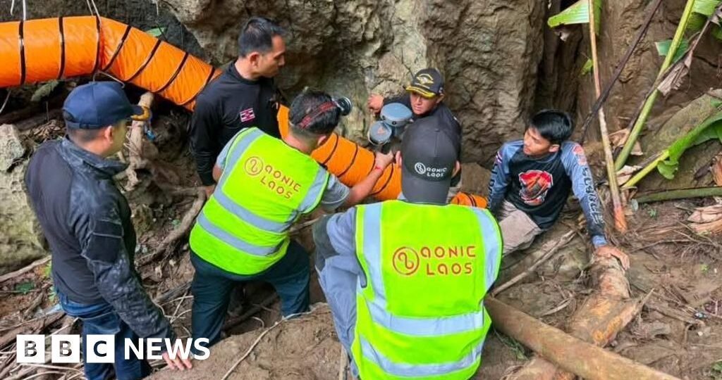 Rescuers race to free seven people trapped in flooded Laos cave
