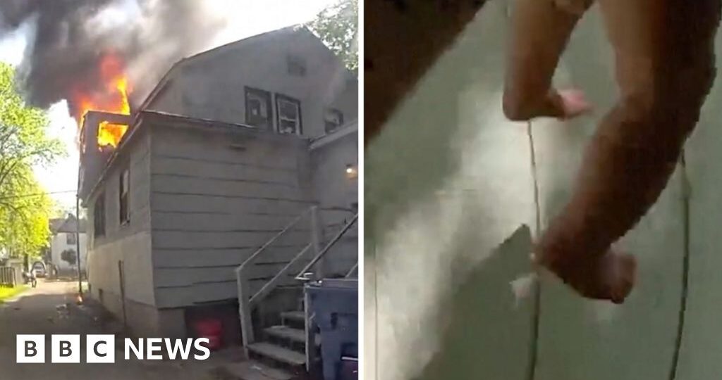 Police officer catches baby dropped from window of burning home