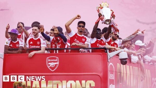 Arsenal fans turn streets red for victory parade