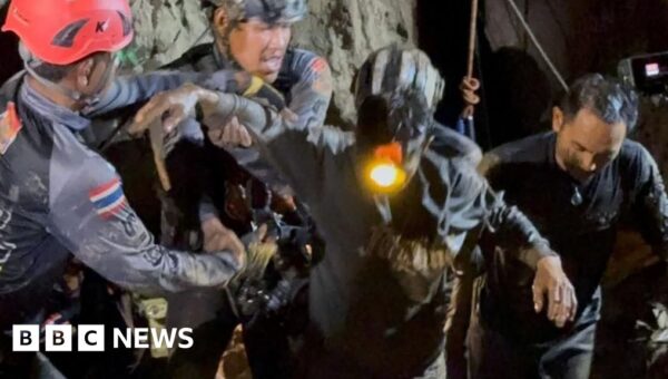 First of five men found alive in flooded Laos cave rescued
