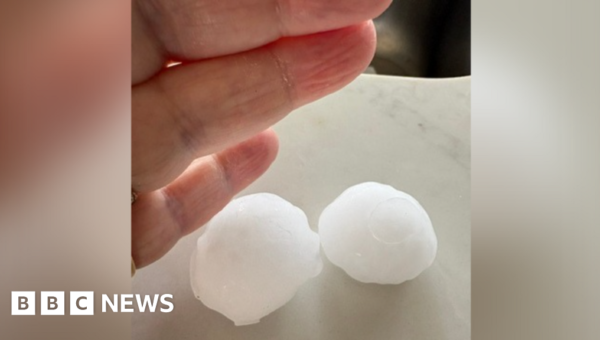 ‘Golf ball-sized’ hailstones damage roofs and cars