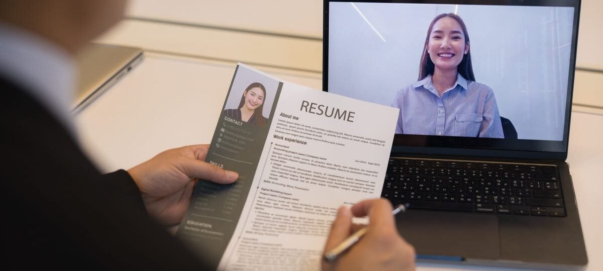 The best way to handle the 'Tell me about yourself' question in a job interview, and how to explain a layoff