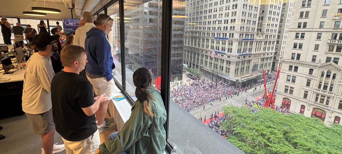 The hottest office perk in NYC today: a front-row view of the Knicks parade