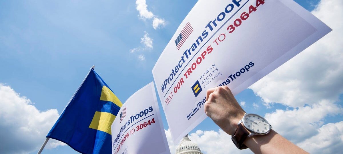 Transgender US troops can continue serving for now, in a major reversal for Trump