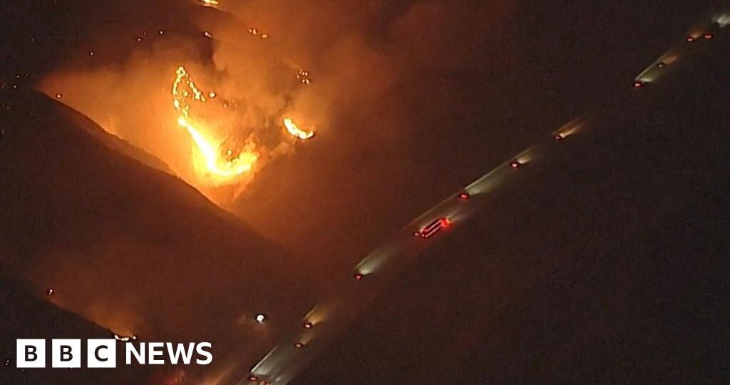 Watch: California wildfires rage near passing vehicles