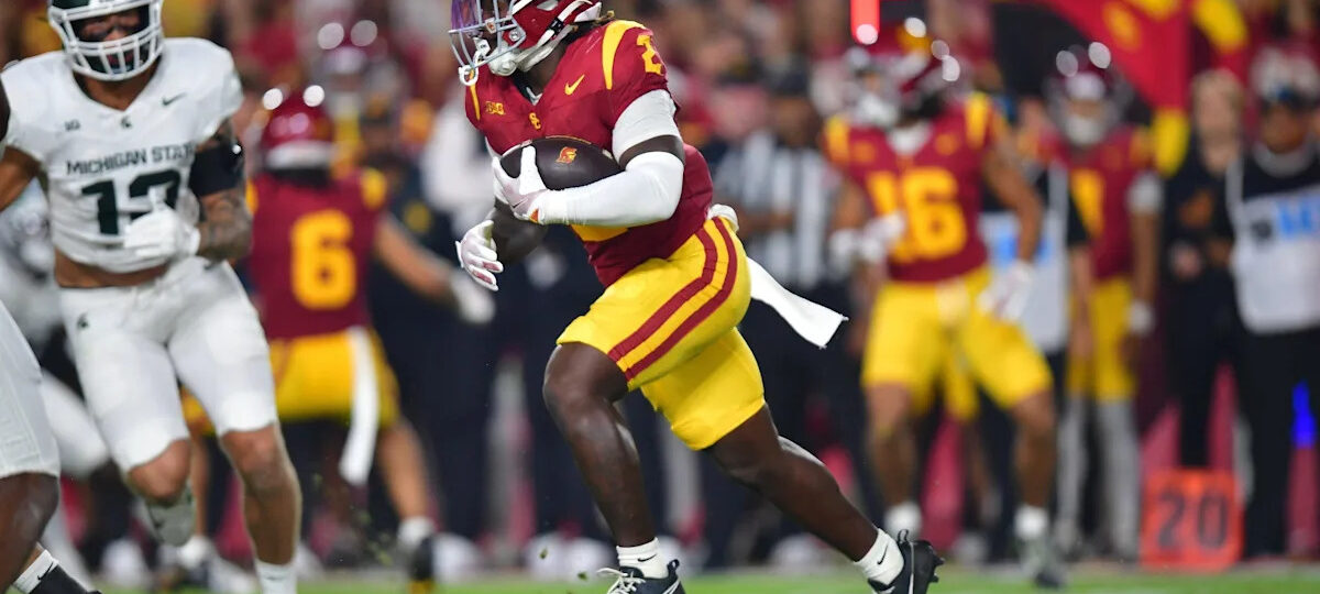USC running back Waymond Jordan throws out first pitch at Yankees game