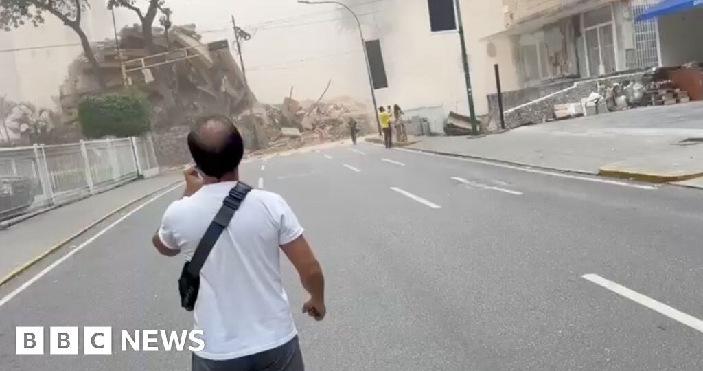 Collapsed buildings in Caracas after quake