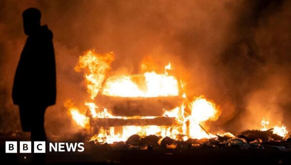 Police officer was set on fire during Ely riots, court told
