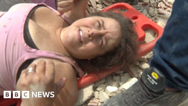 Watch: Moment woman pulled from rubble alive