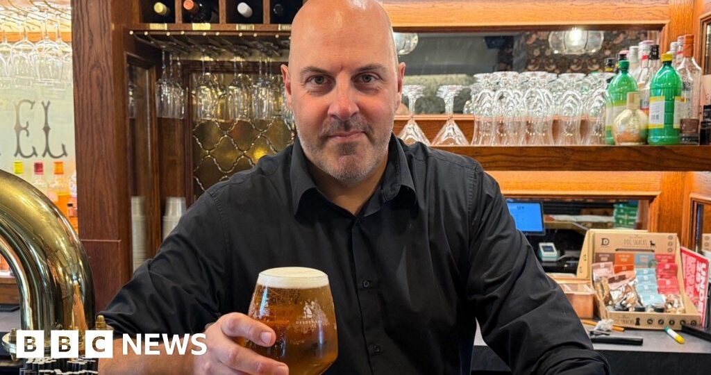 Barman raises a glass after £3.5m Omaze house win