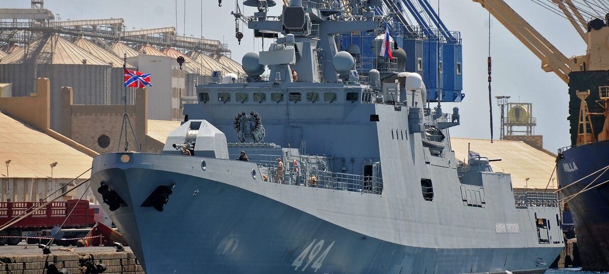 A Russian warship sailing between England and France fired warning shots at a British civilian yacht