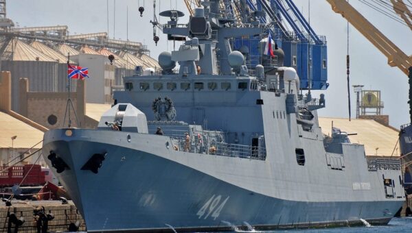 A Russian warship sailing between England and France fired warning shots at a British civilian yacht