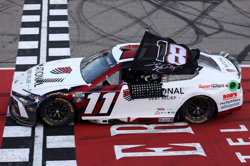 Denny Hamlin used unique flag to pay tribute to Kyle Busch after FireKeepers Casino 400