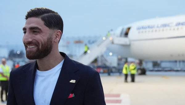 Iran's World Cup players wear pins for victims of deadly strike on school as they arrive in Mexico