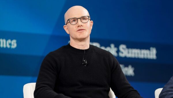 The cost-saving AI measure Coinbase's CEO is taking to keep costs 'roughly flat' while growing token usage