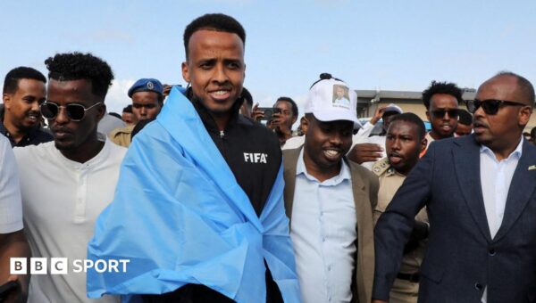World Cup referee denied US entry arrives home to hero’s welcome in Somalia