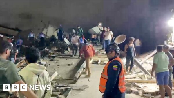 Venezuelan rescuers search through building rubble for survivors