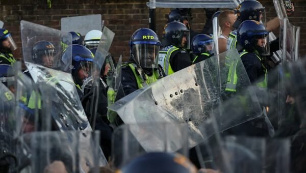 Watch: Protesters and riot police clash near home of Henry Nowak’s killer