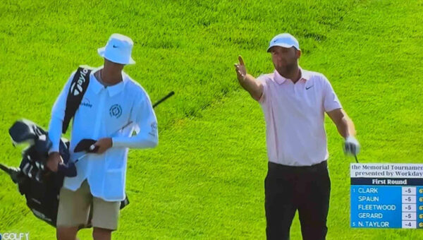 Scottie Scheffler hits into the water. Then comes some words