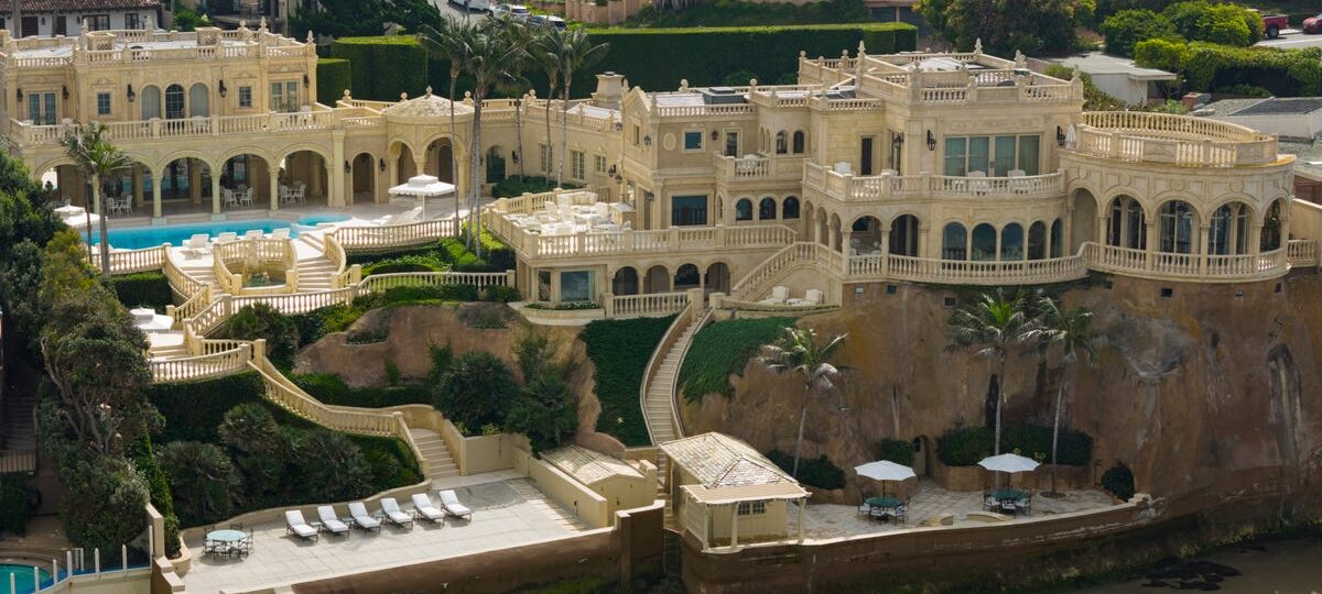 A late tech billionaire's Versailles-inspired California mansion just took a $20 million price cut to $87.5 million. See inside.
