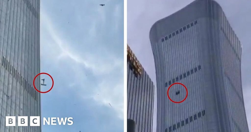 Debris falls after plane hits Beijing's tallest building