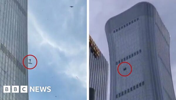 Debris falls after plane hits Beijing’s tallest building