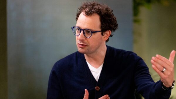 Anthropic CEO says an ‘intrinsic’ feature of AI may be fewer jobs. His answer? Redistribute the upside.