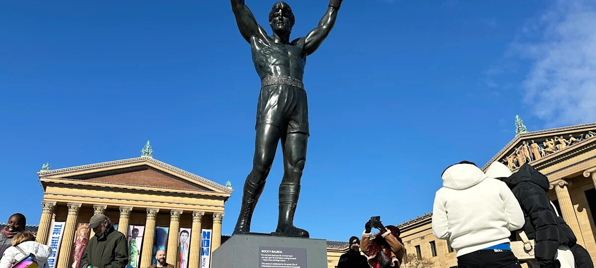 Brazilian soccer fans at the World Cup heed warning not to dress Rocky statue in team gear