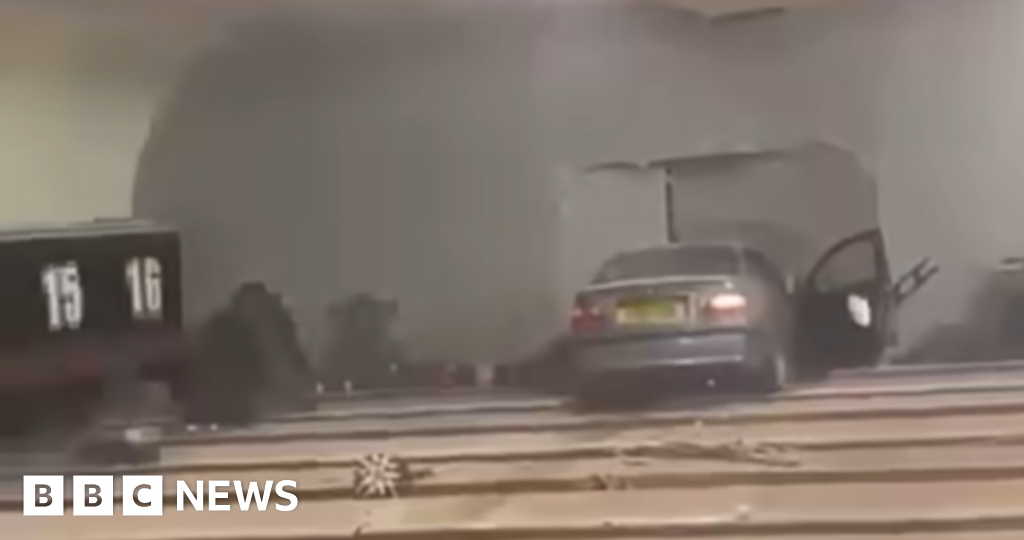 Man charged after car crashes through bowling alley