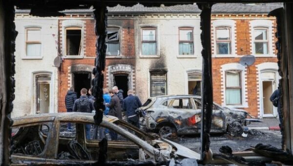 Protesters Torch Buildings And Vehicles, Block Roads Over Belfast Stabbing