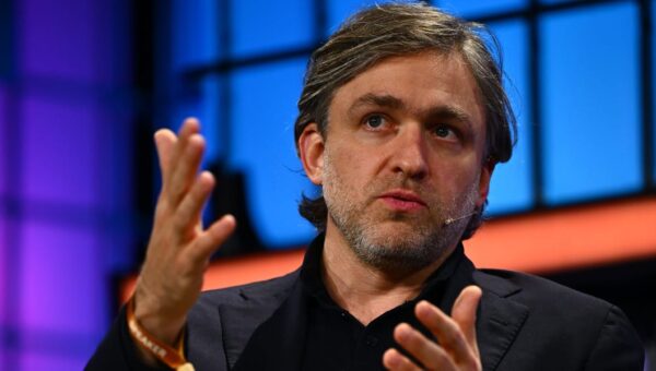 This CEO spent years betting on remote work. Now he’s evolving his stance because of AI.