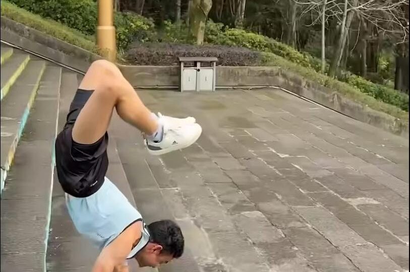Watch: Man walks on his hands down 100 stairs in 44.71 seconds