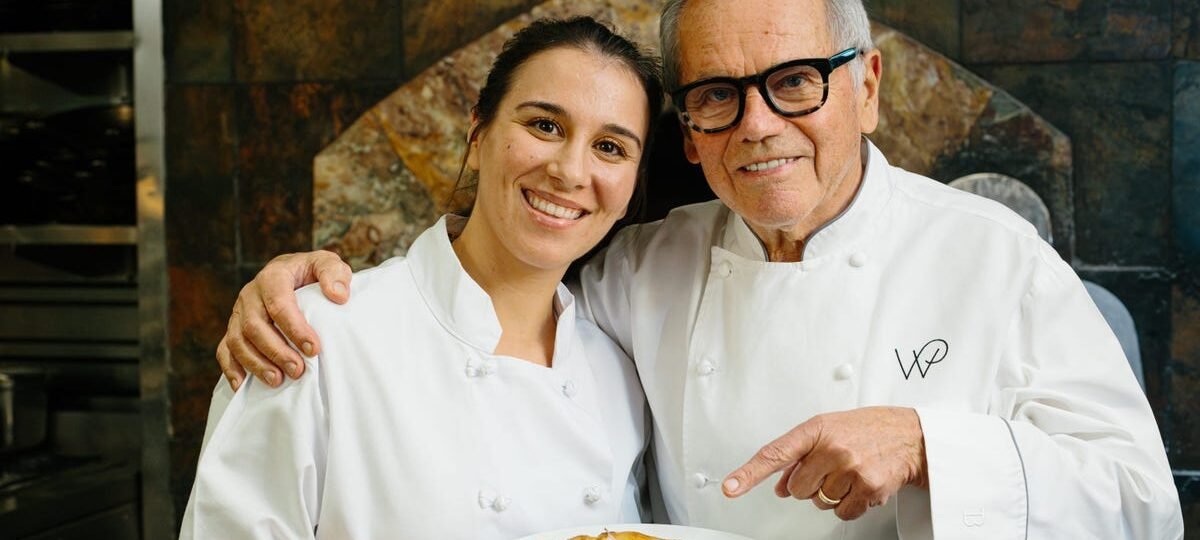 I cooked with Wolfgang Puck at Spago. He showed me how to make his famous pizza.