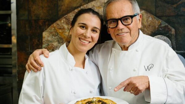 I cooked with Wolfgang Puck at Spago. He showed me how to make his famous pizza.