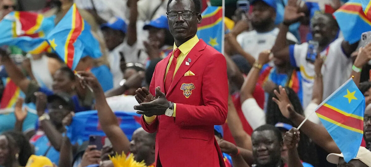 Congo fan who stands as living statue of independence leader Lumumba makes it to World Cup