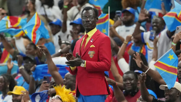 Congo fan who stands as living statue of independence leader Lumumba makes it to World Cup