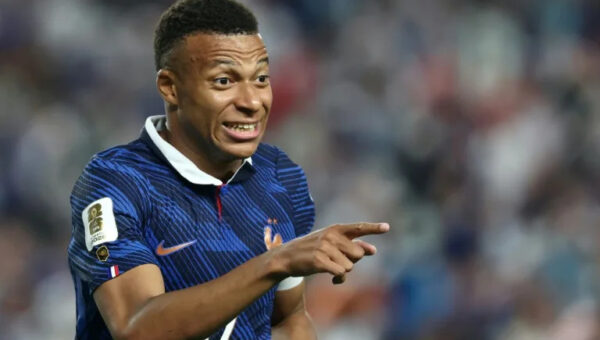 Mbappe scores twice as France beat Iraq at World Cup after two-hour storm delay