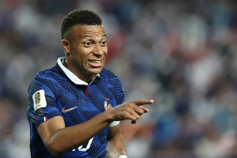 Mbappe scores twice as France beat Iraq at World Cup after two-hour storm delay