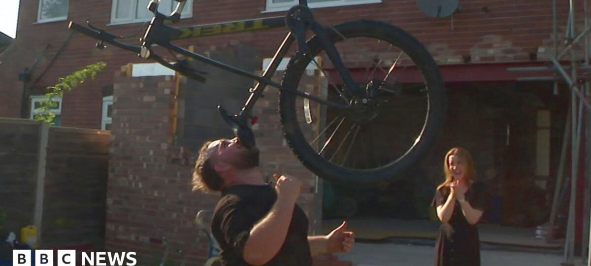 The man who balances bikes, ladders and sheds on his chin