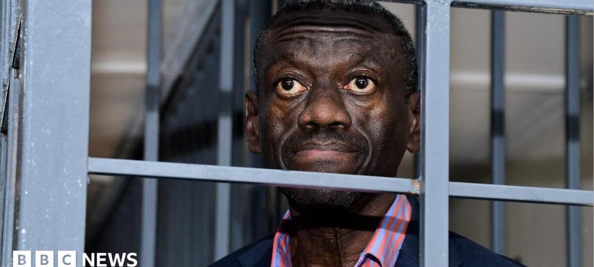 Veteran Ugandan opposition politician collapses in court and in ICU, his wife says