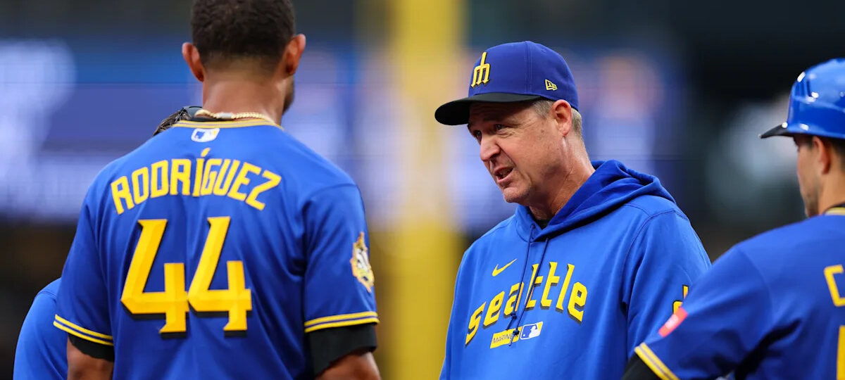 Mariners' Rodriguez removed after being hit in helmet by thrown ball