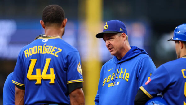 Mariners' Rodriguez removed after being hit in helmet by thrown ball