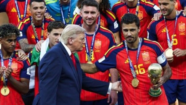 Trump Lingers On Stage To Lap Up Spotlight During World Cup Trophy Presentation