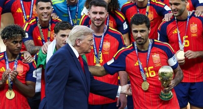 Trump Lingers On Stage To Lap Up Spotlight During World Cup Trophy Presentation