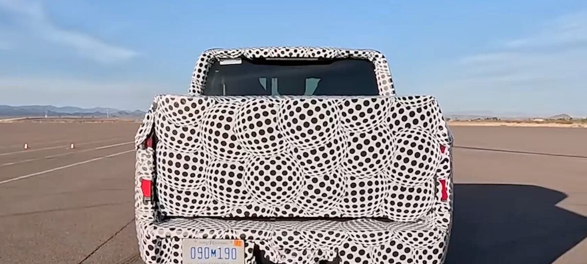 Ford's $30,000 EV truck is under wraps. Its camouflage is an ad.