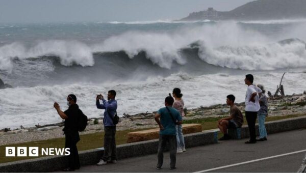 East Asia braces for destructive typhoon as landslides kill 15 in Philippines